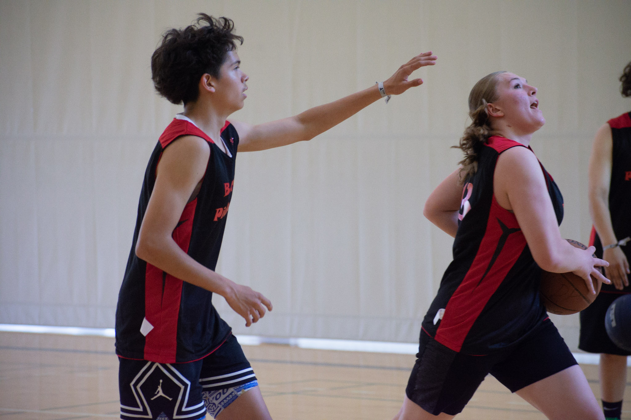 A couple of basketball players in action on the court