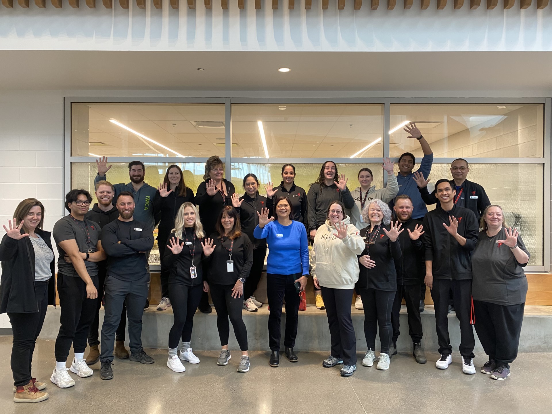 A group of staff at Brookfield Residential YMCA celebrate 5 years