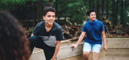 boy playing at outdoor camp