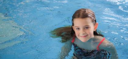 girl smiling in pool