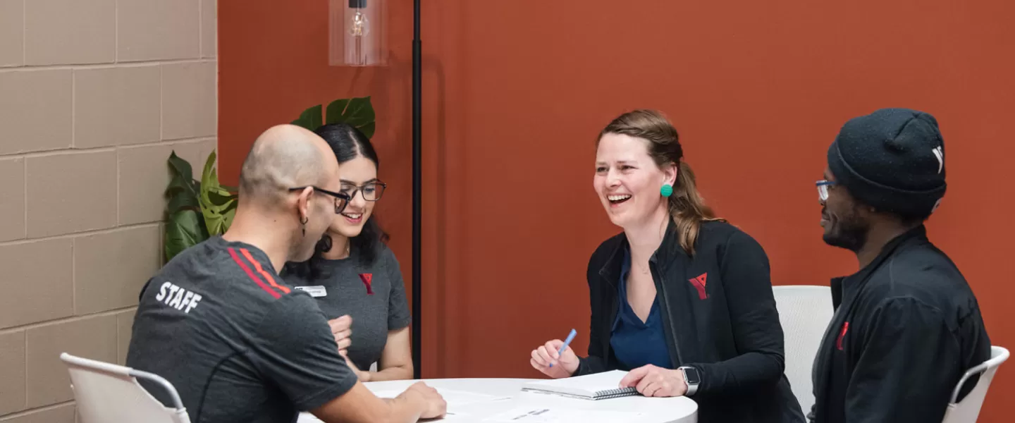 YMCA staff meeting around a table