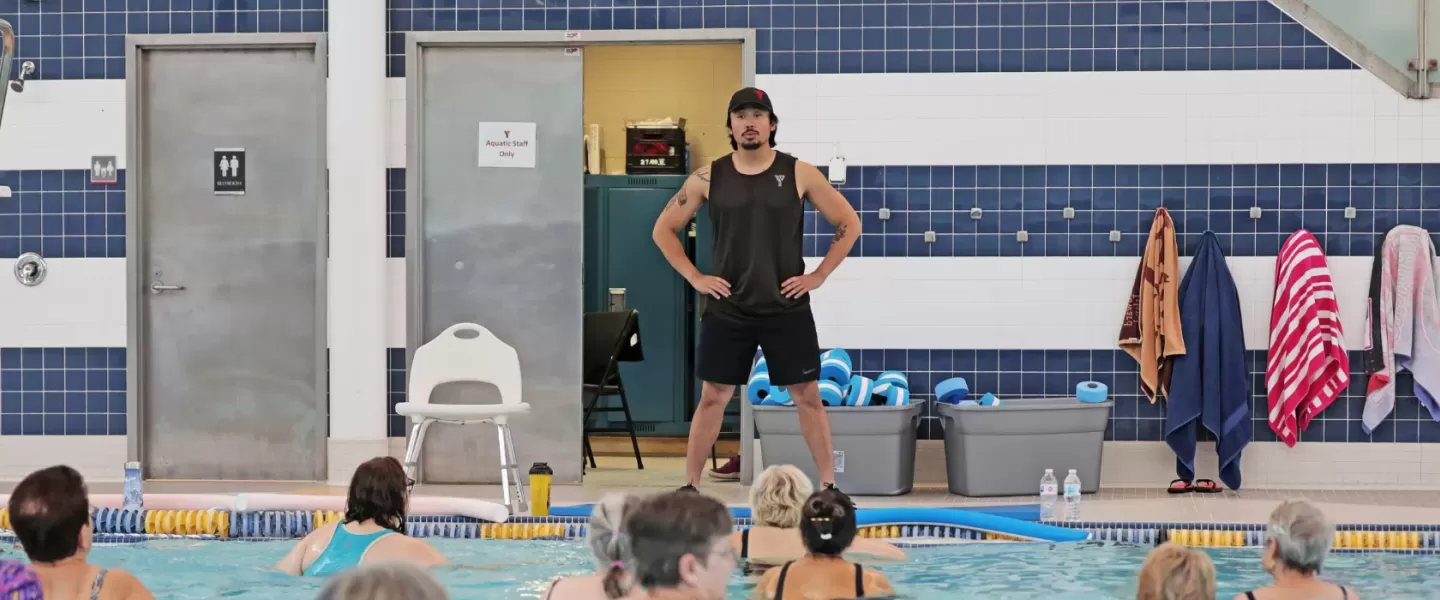 YMCA swim instructor teaching an aquafit class