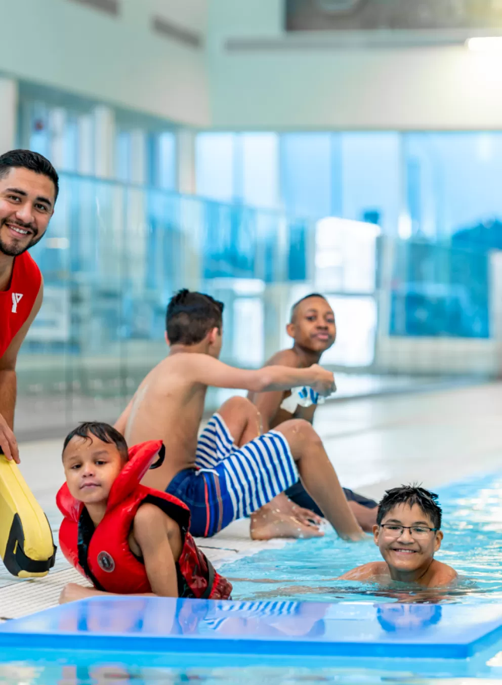 YMCA Lifeguard and kids swimming