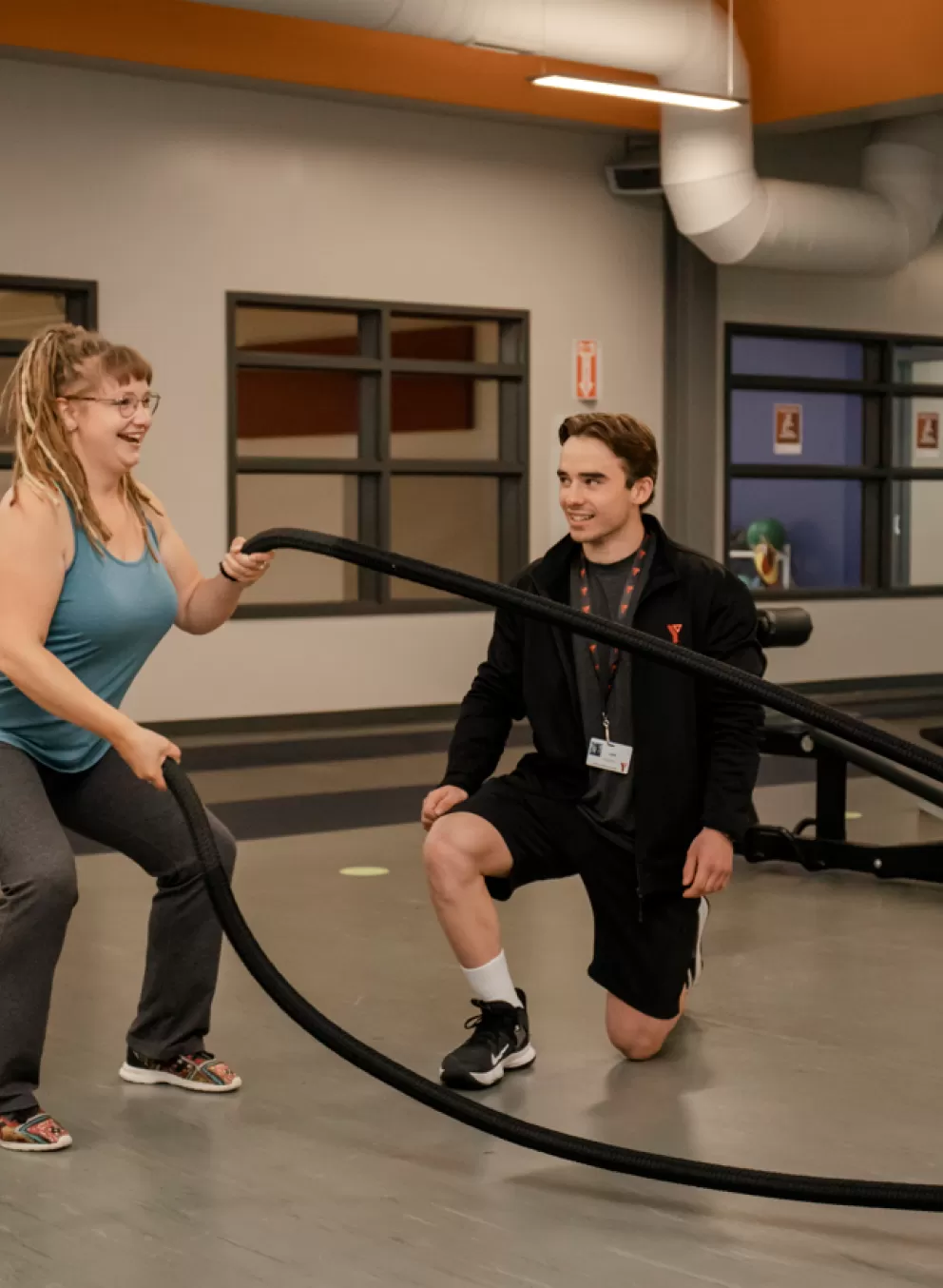 YFit - Certified trainer and client on weight floor