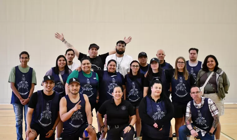 The Indigenous Youth Hoops Tournament committee smiles for a photo