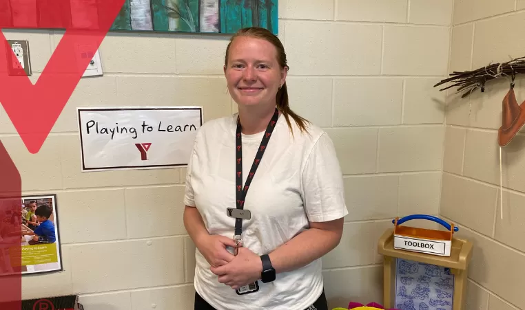 Jacy Volk poses in a childcare room 