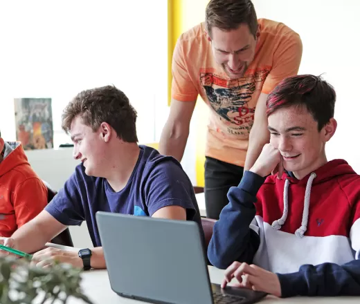group of youth working on computers