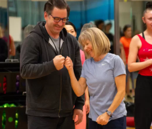 two people bumping fists