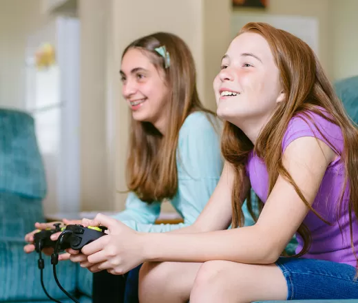 Youth playing video games at home