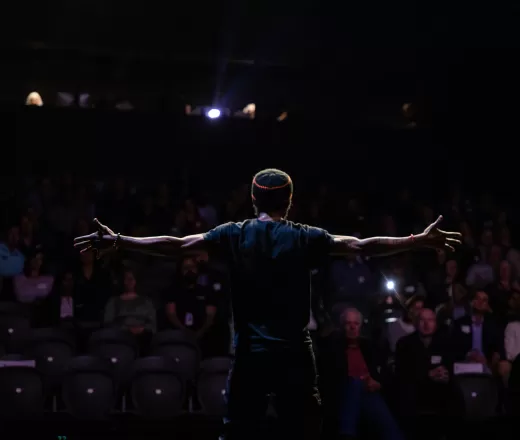 A performer takes the stage at YMCA Arts
