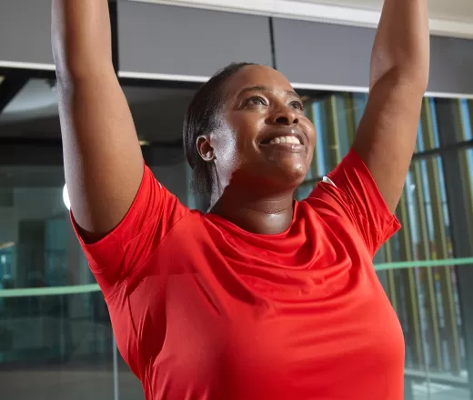 A woman poses in a yoga class
