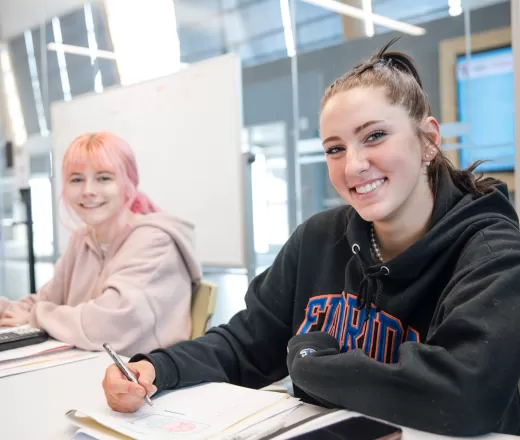 YMCA Tutoring table program - Smiling students