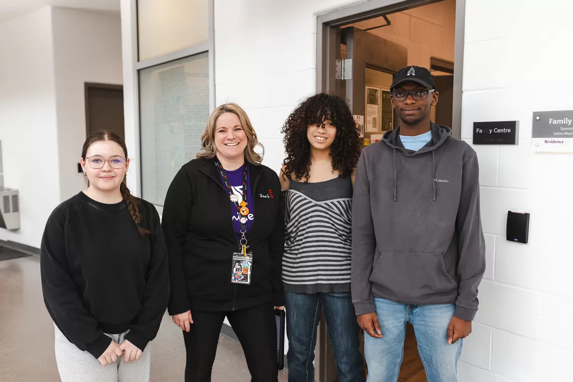 Three girls and a boy smiling