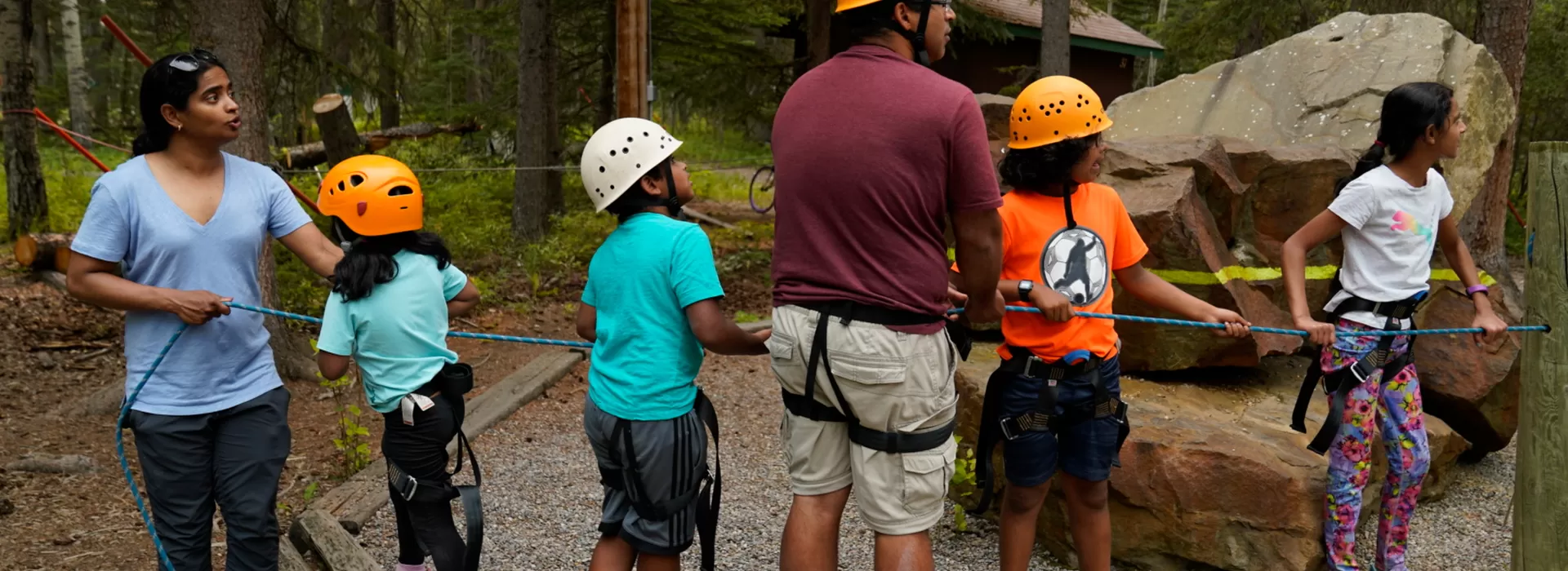 Family preparing to rock climb