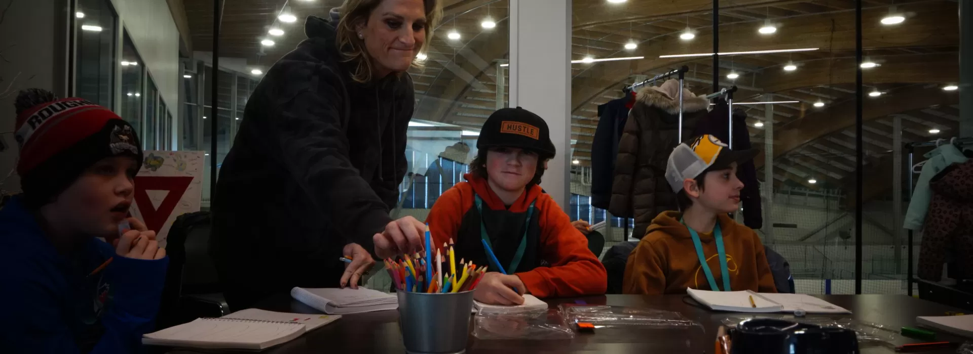 Students and their teachers participating in a journaling activity at Healthy Living School